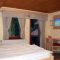 Domačija Ložekar, Alpske sanje, Logarska dolina, Solčava - Dvoulůžkový pokoj 1 s manželskou postelí a balkónem - Pokoj